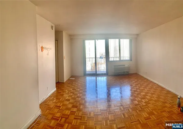 a view of an empty room and window