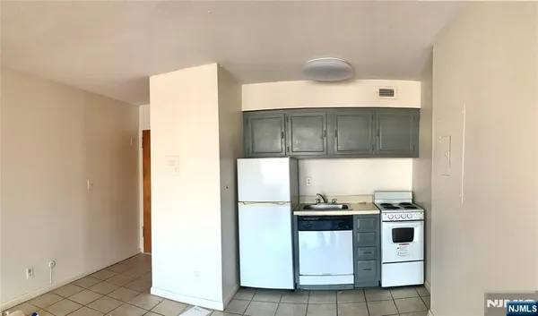 a bathroom with a sink toilet and a mirror