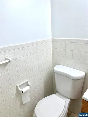 a bathroom with a toilet and a sink