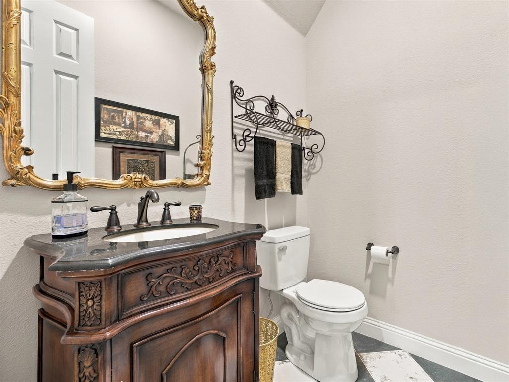 330 Rolling Bnd Road Alvord, TX 76225 - Photo 29 of 36 Powder bath upstairs in the game room.