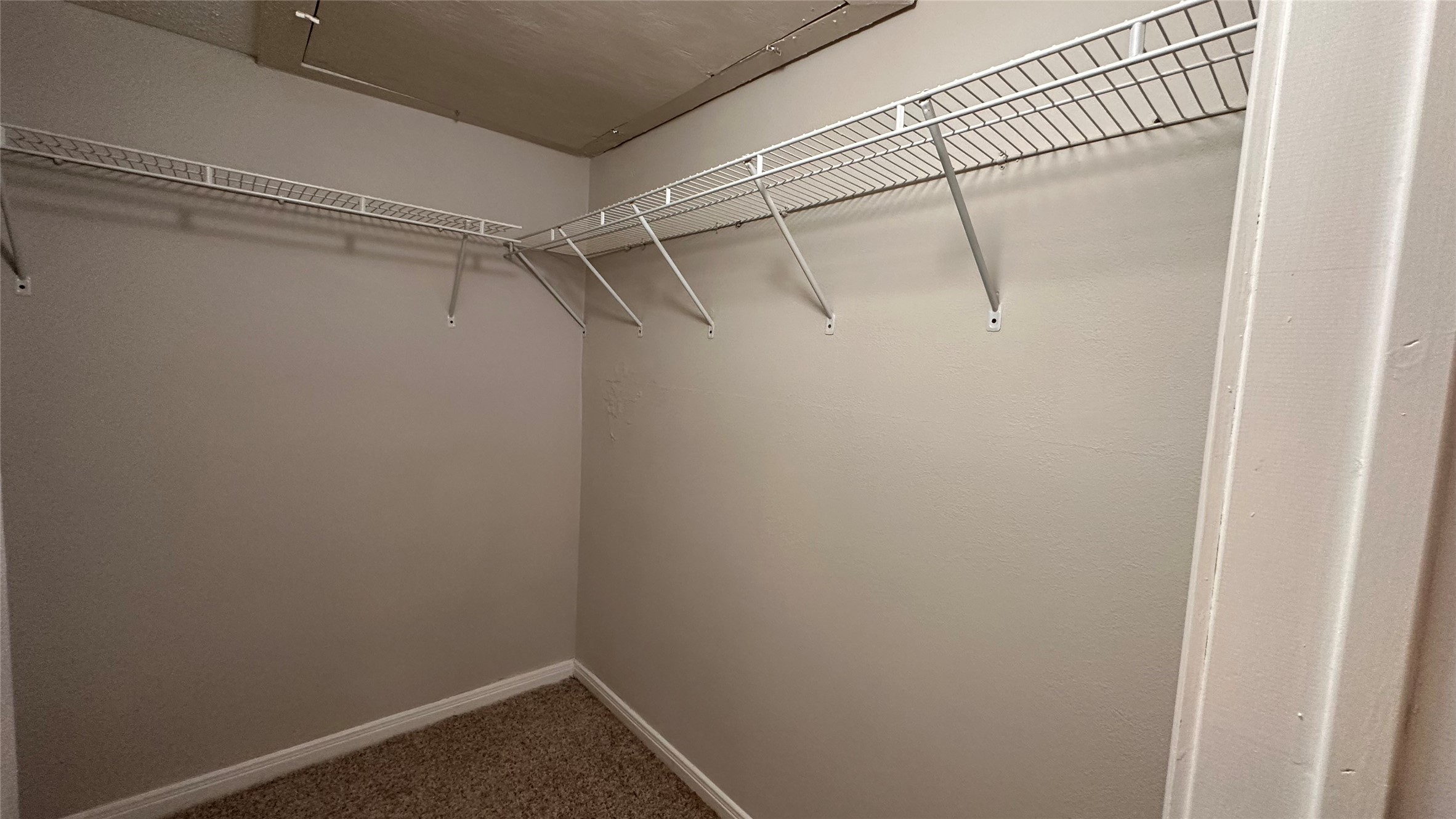 7315 Brompton Street, Unit 127B Houston, TX 77025 - Photo 5 of 13 a view of a room with racks on the wall