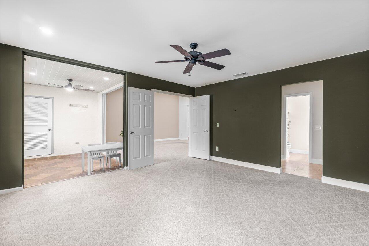 9240 Sabal Ridge Circle, Unit B Boca Raton, FL 33428 - Photo 11 of 22 Primary suite overlooks greenery
