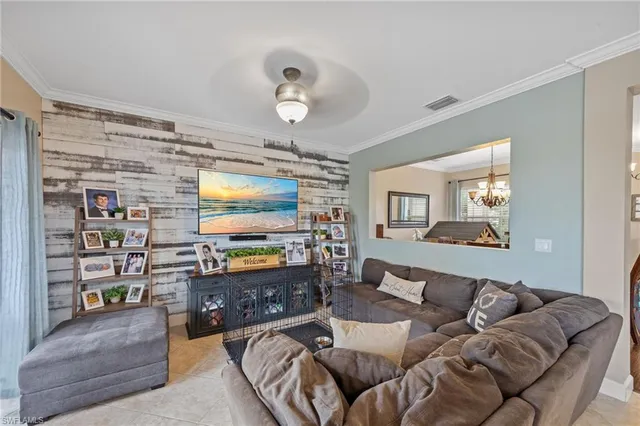 a living room with fireplace furniture and a flat screen tv