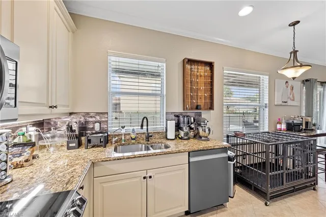 a kitchen with a sink and a refrigerator