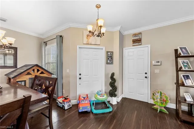 a bedroom with furniture and a wooden floor