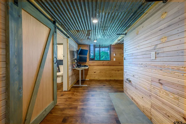 a view of a patio with wooden floor