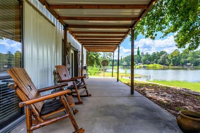 a view of a ocean with wooden floor and outdoor space