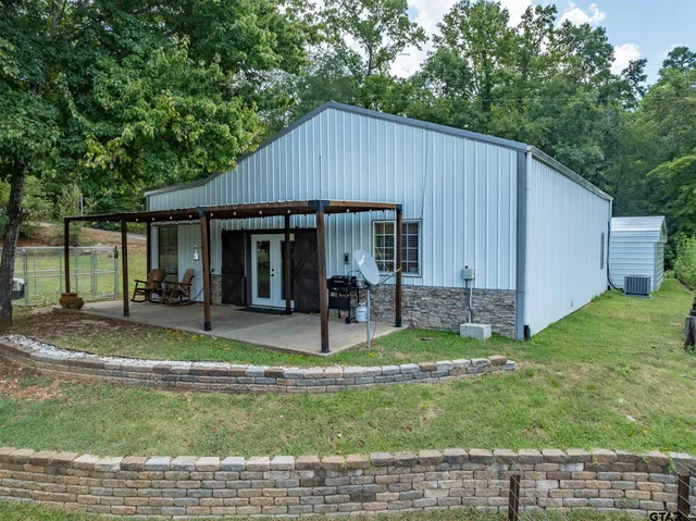 a house view with a garden space