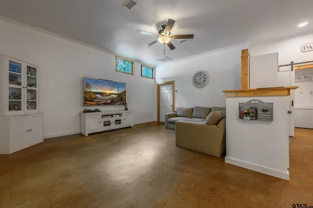a living room with furniture and a window