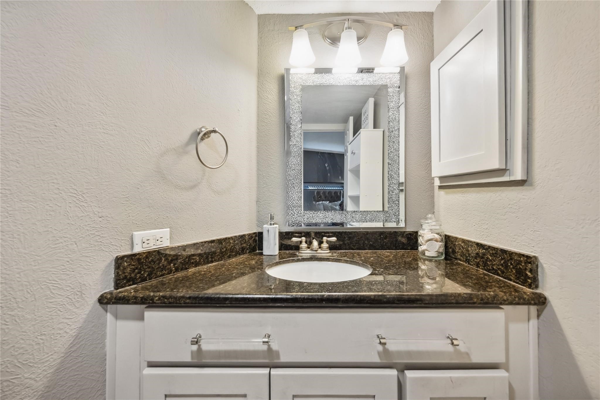 3525 Sage Road, Unit 1713 Houston, TX 77056 - Photo 13 of 25 a bathroom with a granite countertop sink and a mirror