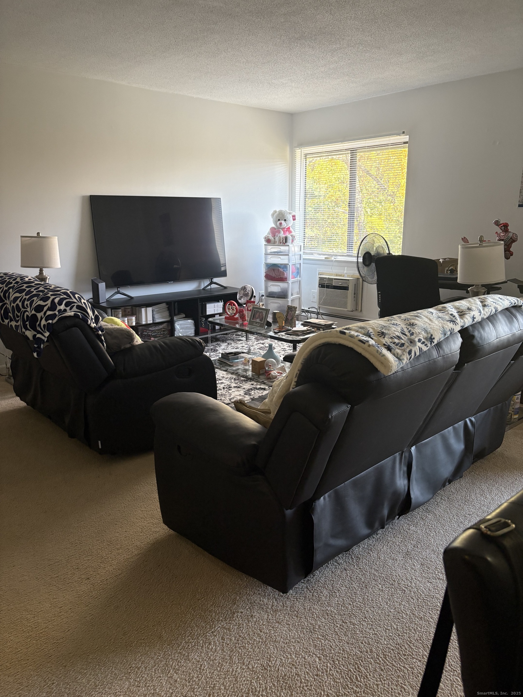 962 High Path Road, Unit 962 Windsor, CT 06095 - Photo 5 of 14 a living room with furniture and a flat screen tv