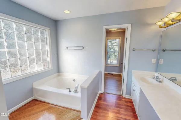 a bathroom with a bathtub and a sink