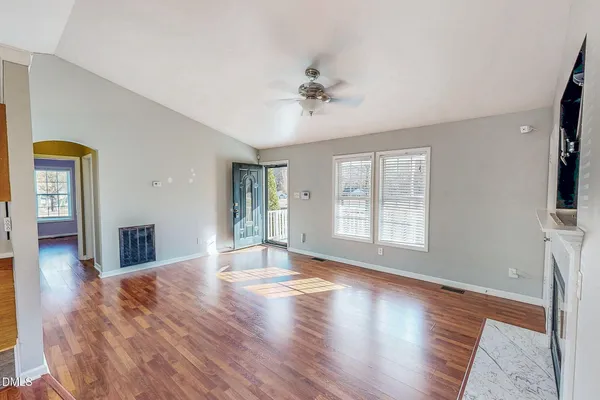 a view of livingroom with window hardwood floor and ceiling fan