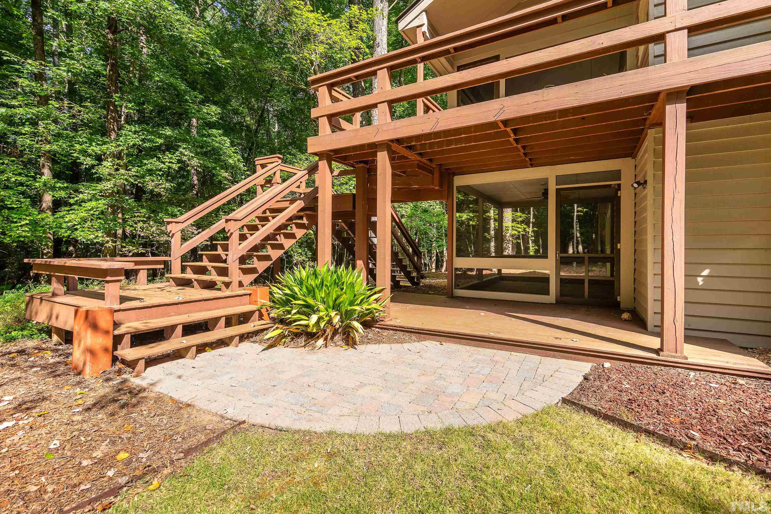 12217 Old Creedmoor Road Raleigh, NC 27613 - Photo 32 of 41 a balcony with table and chairs