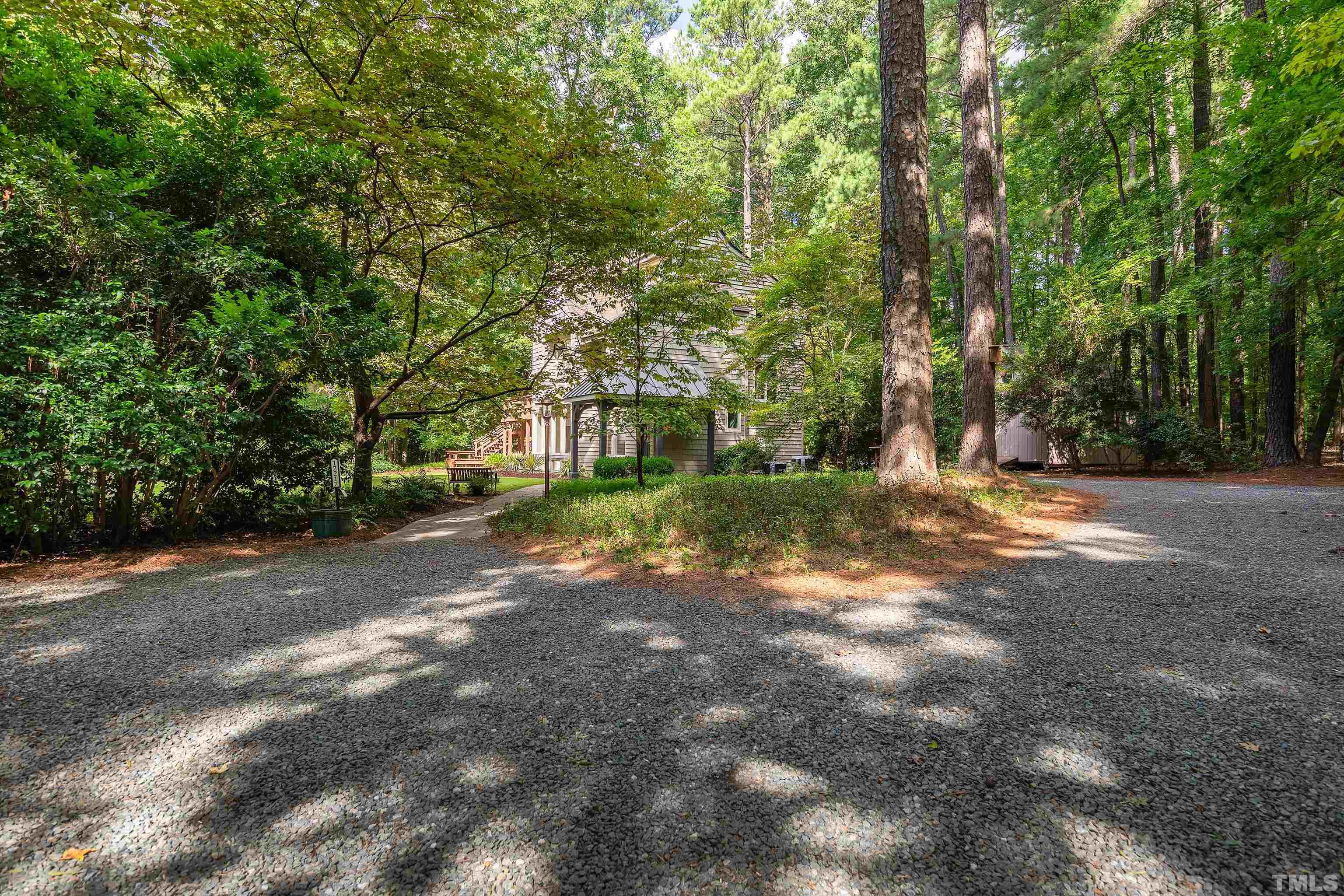 12217 Old Creedmoor Road Raleigh, NC 27613 - Photo 35 of 41 a view of a tree in the middle of a yard