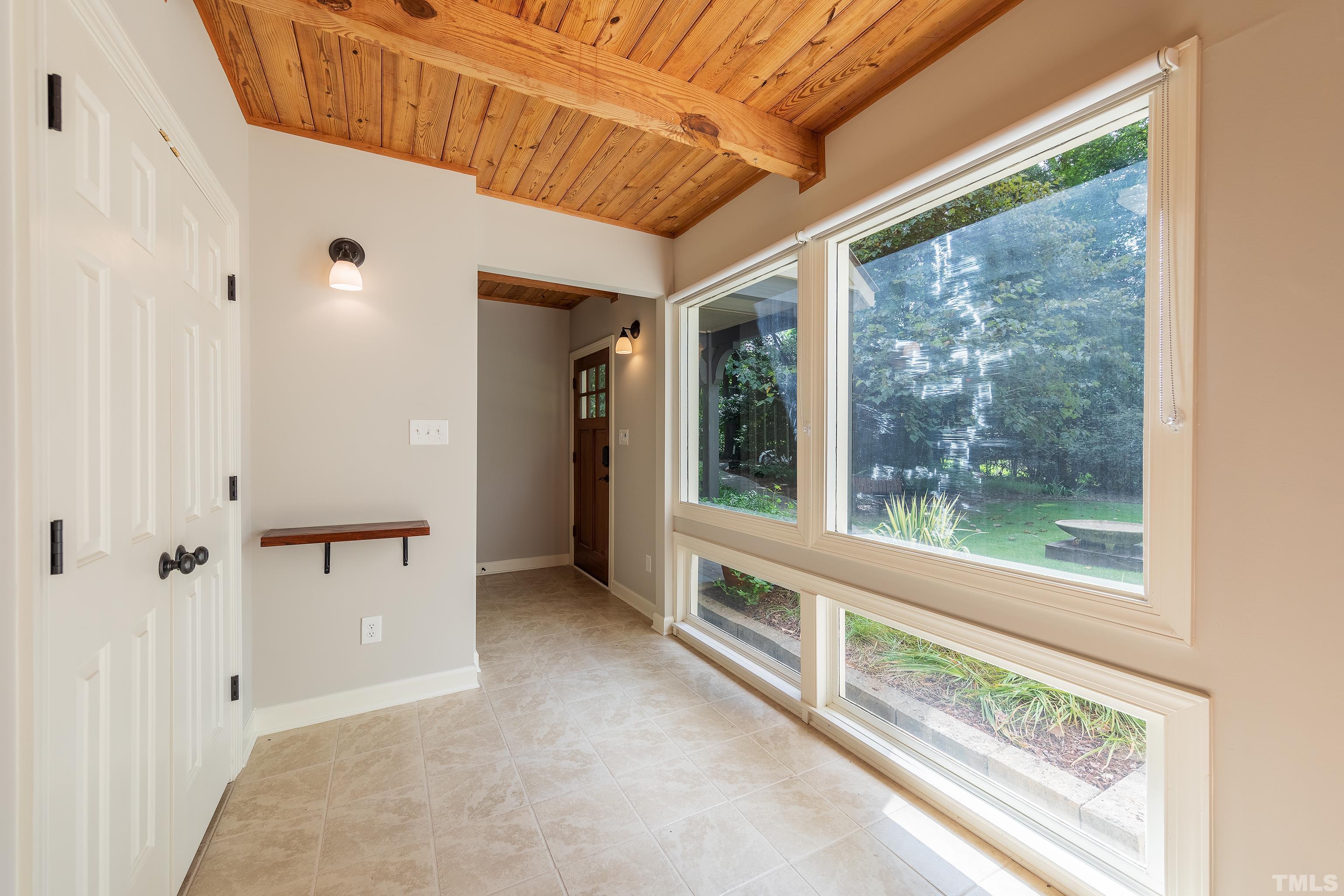 12217 Old Creedmoor Road Raleigh, NC 27613 - Photo 4 of 41 a view of a large window with an outdoor space