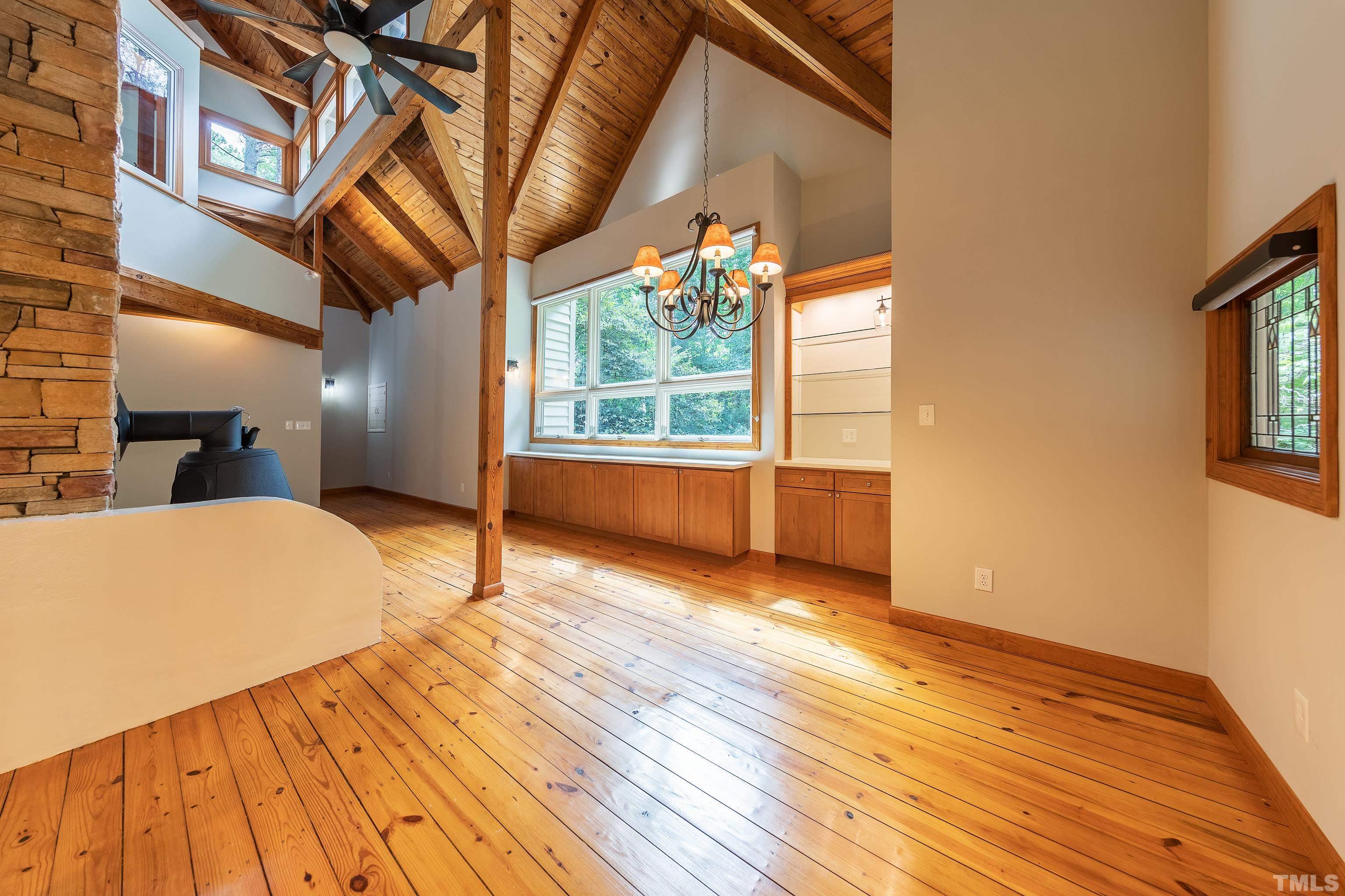 12217 Old Creedmoor Road Raleigh, NC 27613 - Photo 8 of 41 a view of a room with wooden floor and windows