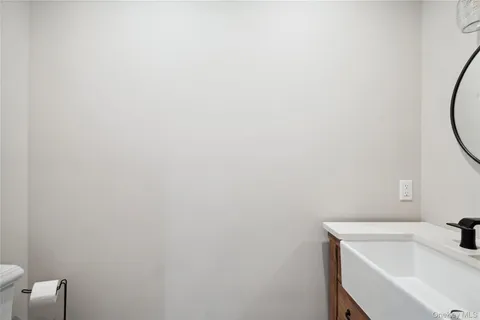a bathroom with a sink and cabinets