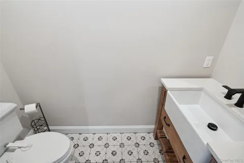 a bathroom with a sink and toilet