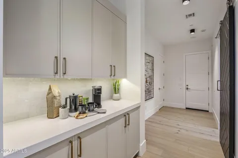 a kitchen with sink and cabinets