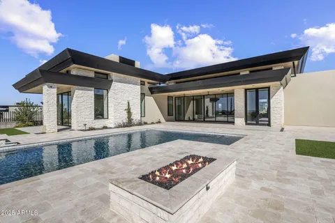 a view of a house with backyard and porch