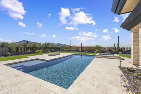 a view of a swimming pool with an outdoor seating