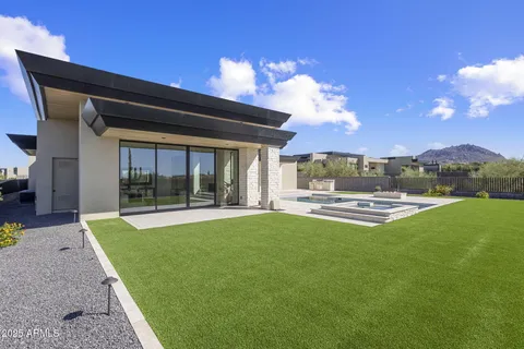 a view of a swimming pool with an outdoor seating