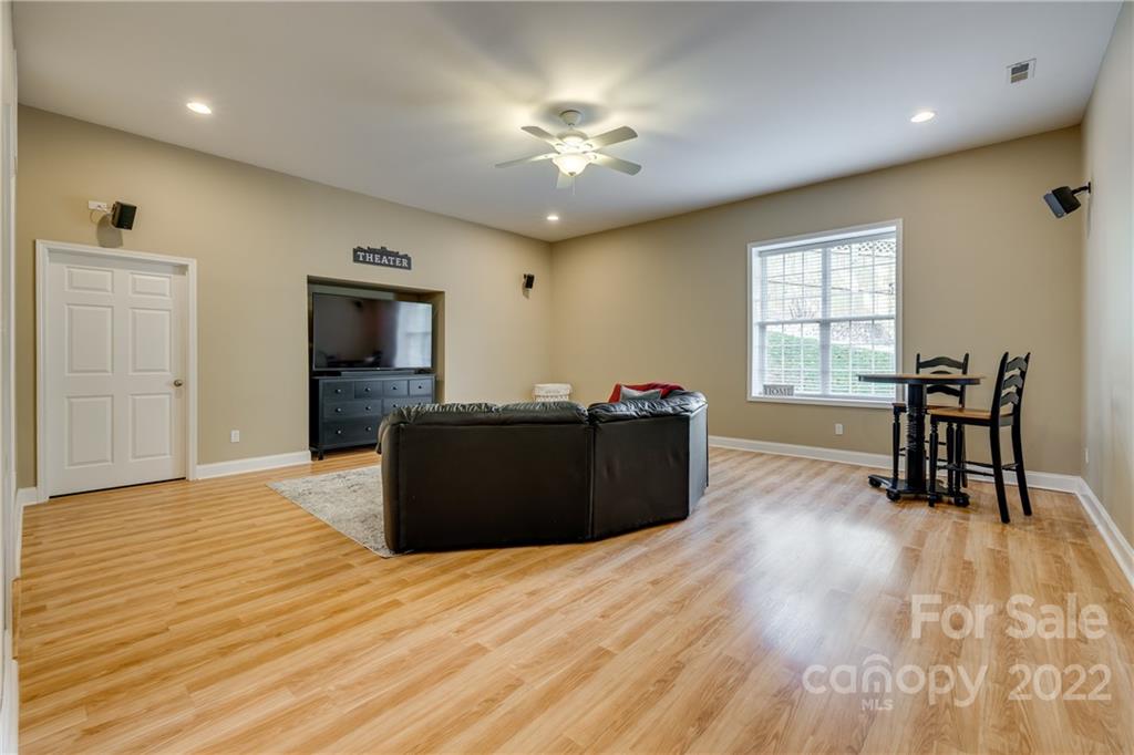1358 Crown Ridge Drive Fort Mill, SC 29708 - Photo 35 of 47 a living room with furniture and a flat screen tv