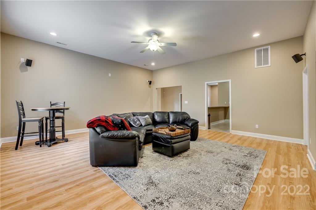 1358 Crown Ridge Drive Fort Mill, SC 29708 - Photo 36 of 47 a living room with furniture and a wooden floor