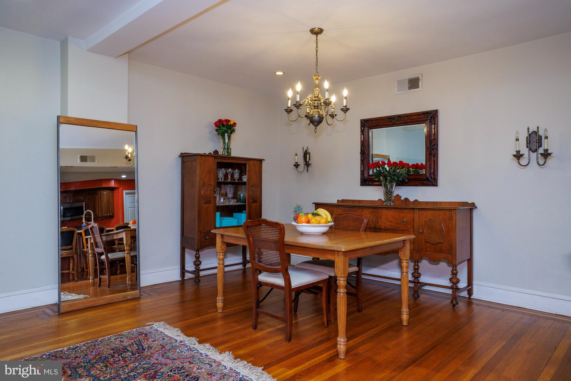 1901 Walnut Street, Unit 2E Philadelphia, PA 19103 - Photo 5 of 21 a view of a dining room with furniture and wooden floor