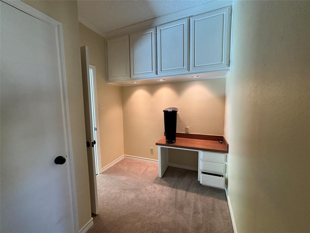 4702 Ranch View Road Fort Worth, TX 76109 - Photo 20 of 40 Built-in desk with wood-finish countertop, under-cabinet lighting, and integrated cabinetry