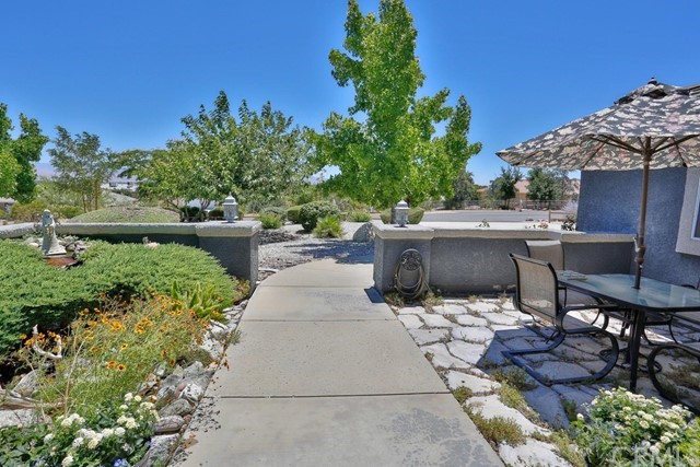 20058 Rancherias Lane Apple Valley, CA 92307 - Photo 16 of 83 a view of backyard with outdoor seating and green space