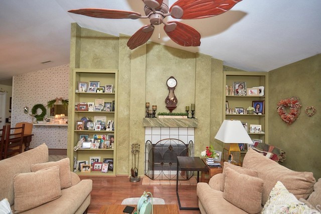 20058 Rancherias Lane Apple Valley, CA 92307 - Photo 23 of 83 a living room with furniture a rug and a wall painting