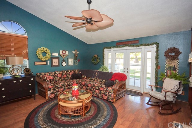 20058 Rancherias Lane Apple Valley, CA 92307 - Photo 25 of 83 a living room with furniture and a chandelier