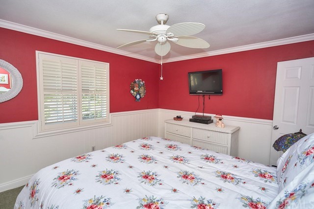 20058 Rancherias Lane Apple Valley, CA 92307 - Photo 47 of 83 a bedroom with a bed and a flat screen tv