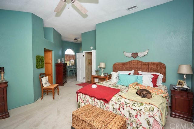 20058 Rancherias Lane Apple Valley, CA 92307 - Photo 51 of 83 a bedroom with two beds and a lamp