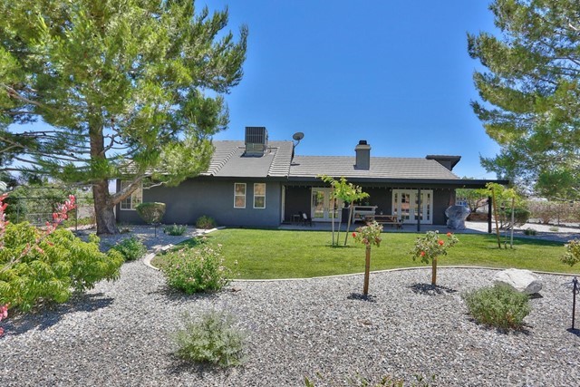 20058 Rancherias Lane Apple Valley, CA 92307 - Photo 65 of 83 a front view of a house with a yard