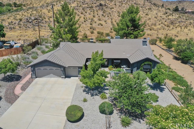 20058 Rancherias Lane Apple Valley, CA 92307 - Photo 81 of 83 an aerial view of a house with yard and mountain view in back