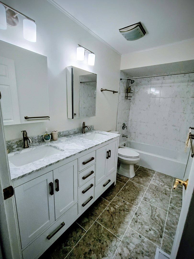 1367 South Elizabeth Street Lombard, IL 60148 - Photo 16 of 21 a bathroom with a granite countertop sink toilet and mirror