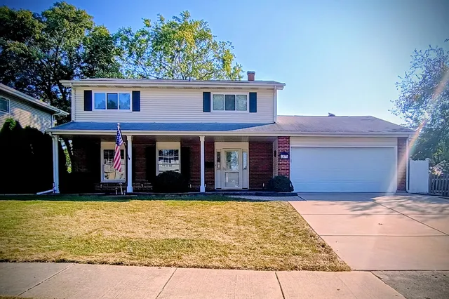 a view of a brick house with many windows
