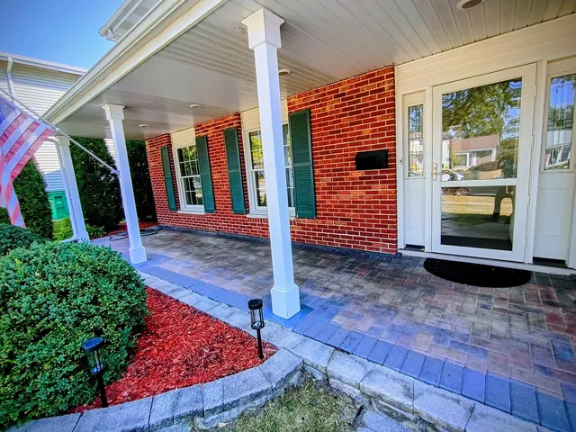 a view of a backyard with pathway