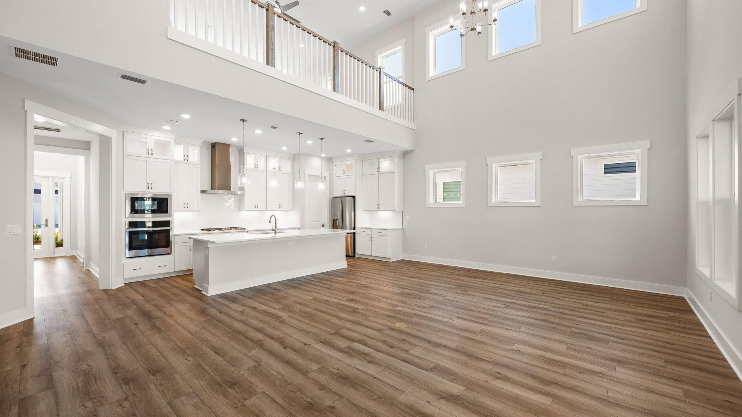 40 Dunns Circle Inlet Beach, FL 32461 - Photo 17 of 69 a large white kitchen with stainless steel appliances kitchen island a large counter top and a wooden floors