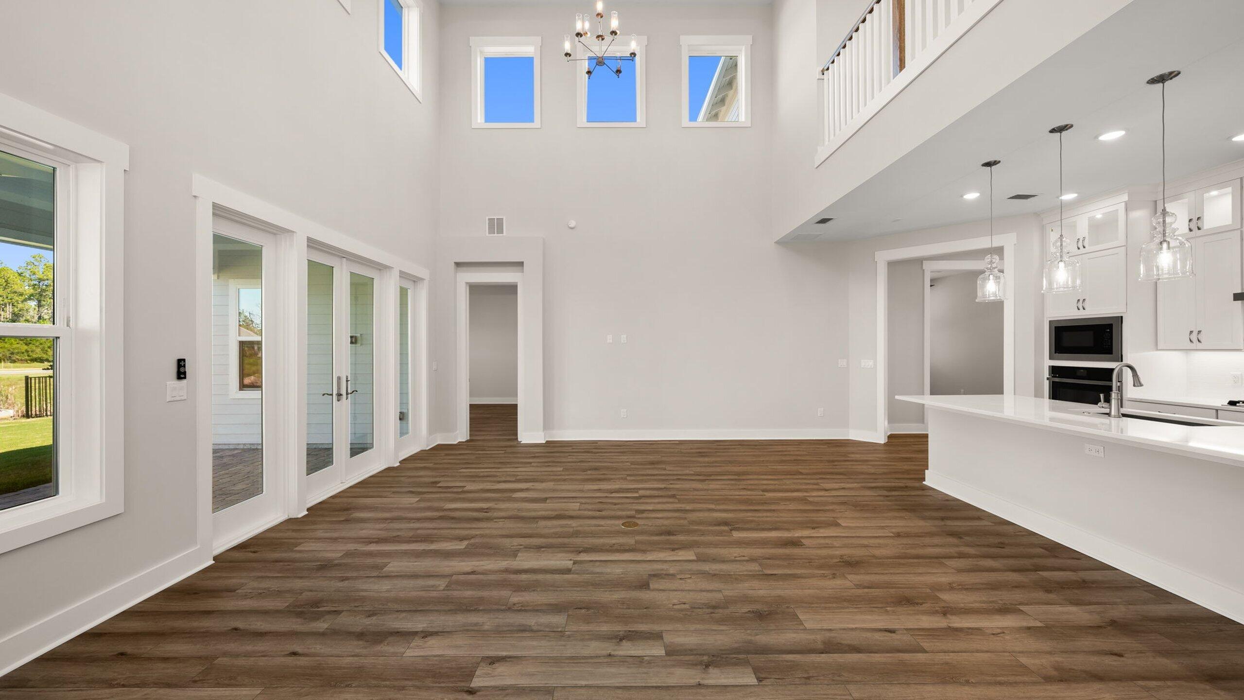 40 Dunns Circle Inlet Beach, FL 32461 - Photo 19 of 69 a view of a hallway with wooden floor and a kitchen