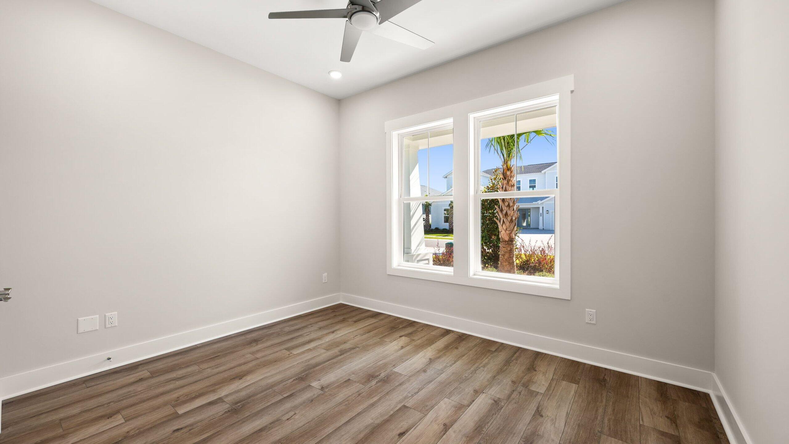 40 Dunns Circle Inlet Beach, FL 32461 - Photo 26 of 69 an empty room with wooden floor chandelier and windows