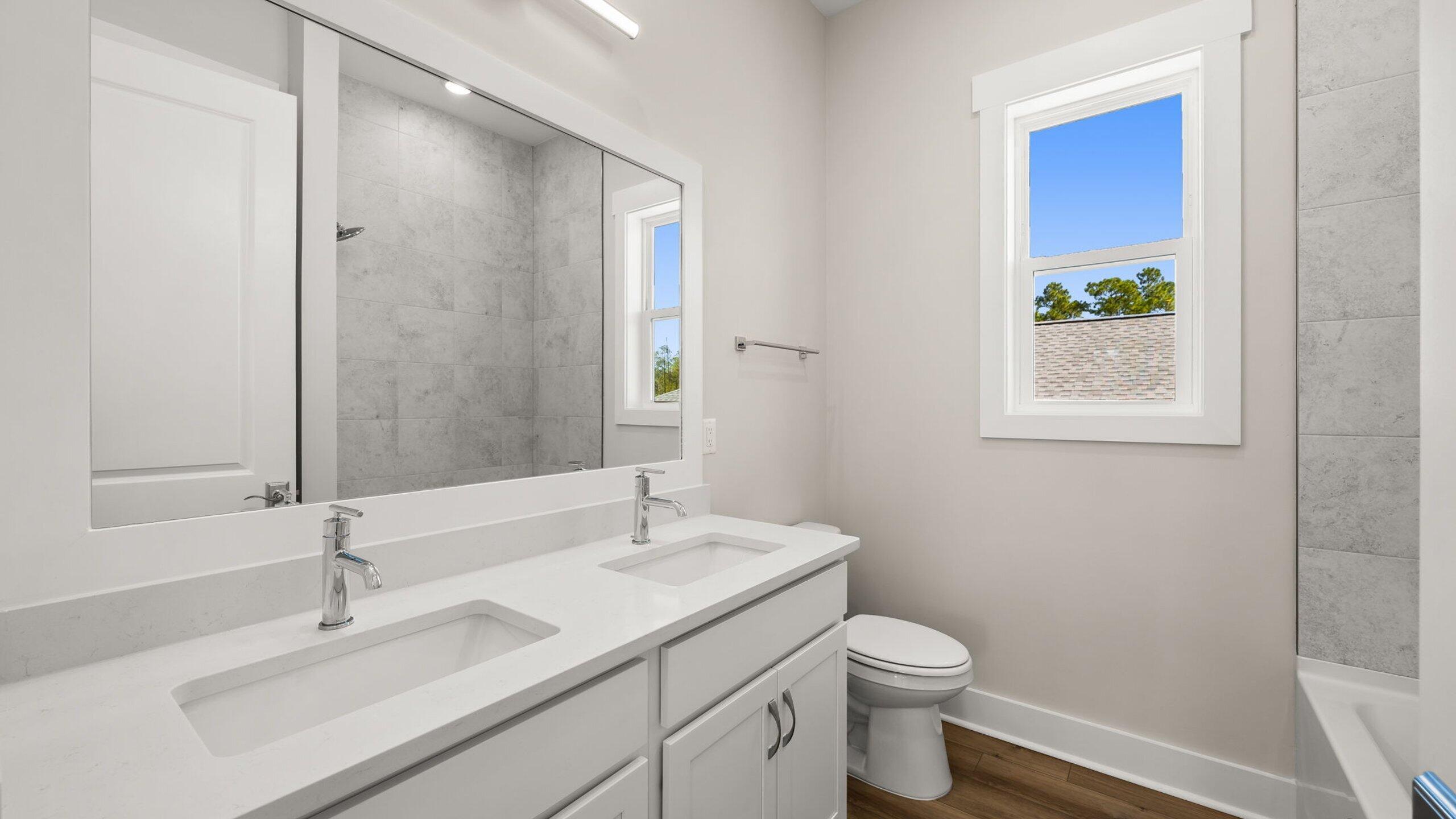 40 Dunns Circle Inlet Beach, FL 32461 - Photo 41 of 69 a bathroom with a toilet a sink and a mirror
