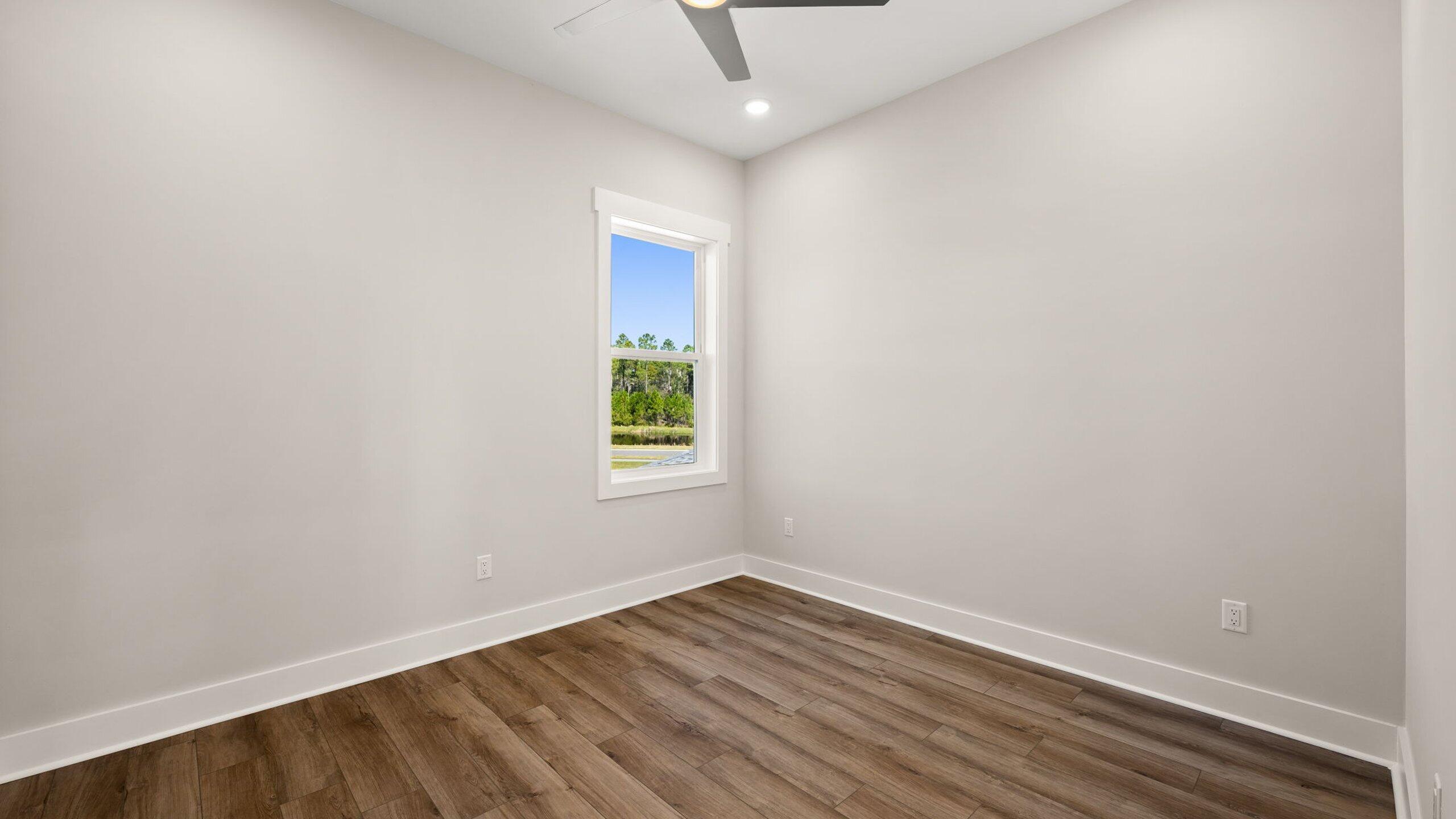 40 Dunns Circle Inlet Beach, FL 32461 - Photo 42 of 69 a view of an empty room with wooden floor and a window