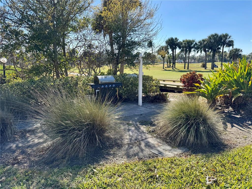 12300 Vonn Road, Unit 5304 Largo, FL 33774 - Photo 11 of 21 a view of swimming pool outdoor seating and lake