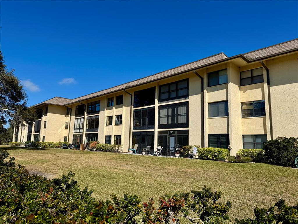 12300 Vonn Road, Unit 5304 Largo, FL 33774 - Photo 12 of 21 a front view of a building with a garden