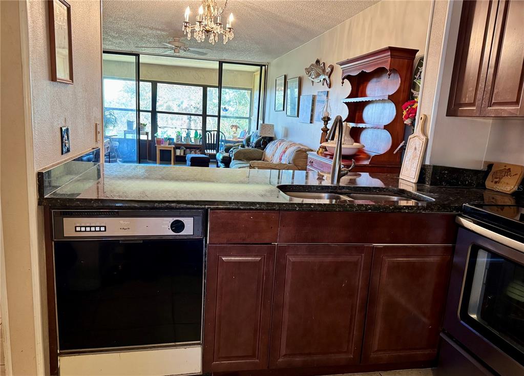 12300 Vonn Road, Unit 5304 Largo, FL 33774 - Photo 15 of 21 a kitchen with a refrigerator and a sink