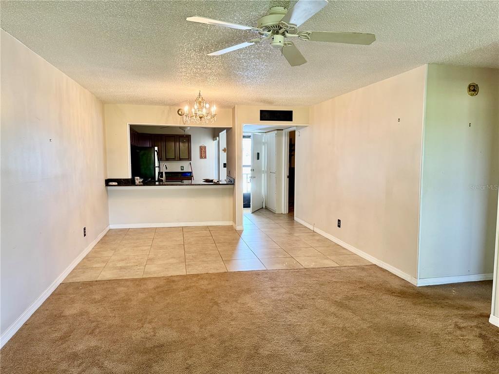 12300 Vonn Road, Unit 5304 Largo, FL 33774 - Photo 17 of 21 wooden floor in an empty room with a fireplace